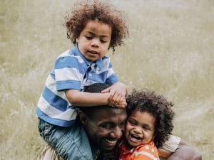 Happy dad with children